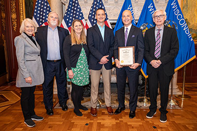 Financial literacy award group with Governor Evers